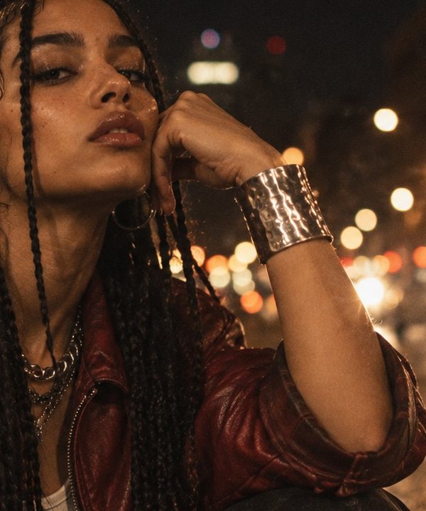 Model in a red leather jacket wearing a hammered silver cuff